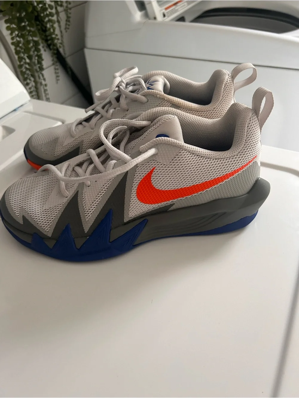 Nike Men's Light Gray Mesh Sneakers with Orange Swoosh and Blue Accents